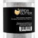 Clear jar of white Brew Glitter, a color-changing, FDA-compliant beverage shimmer.