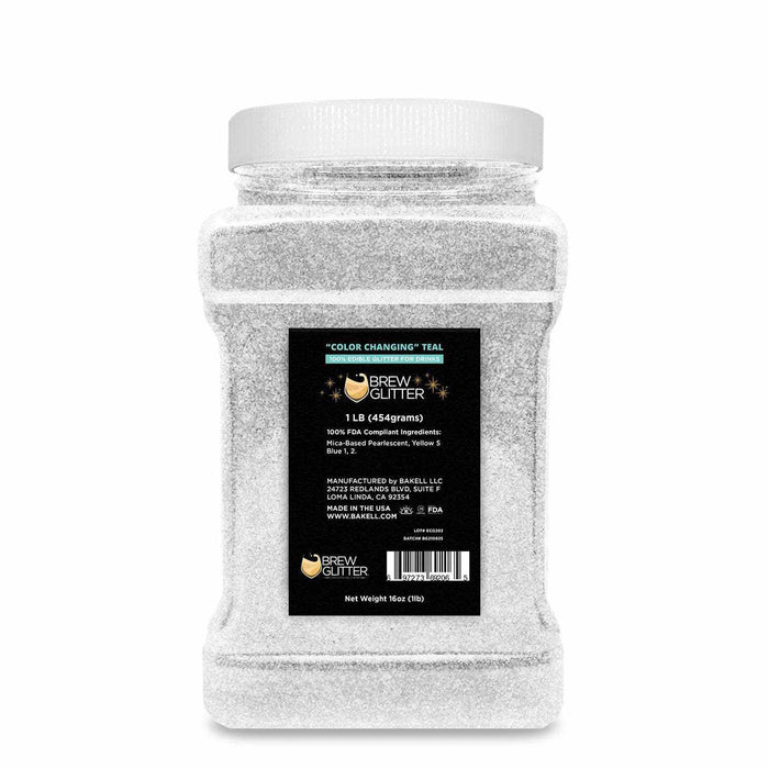 1 lb container of white "Color Changing" Teal Brew Glitter, a food-grade edible shimmer for beverages.