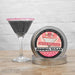 sugar rimmed dark glitter drink next to pink glitter sugar tin