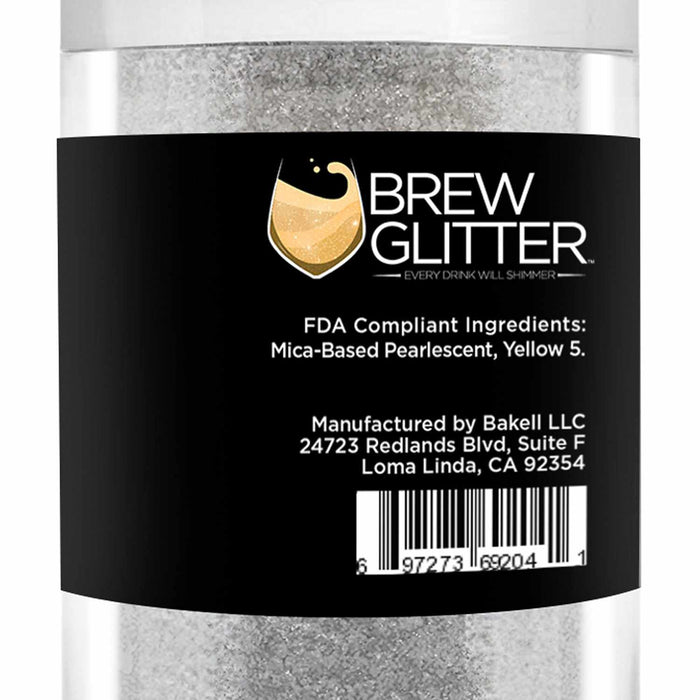 Clear jar of Yellow Color Changing Brew Glitter, appearing white and shimmery, with a black label.