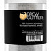 Clear jar of Yellow Color Changing Brew Glitter, appearing white and shimmery, with a black label.