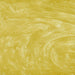Swirling yellow edible glitter particles creating a shimmering, metallic gold texture in a liquid beverage.