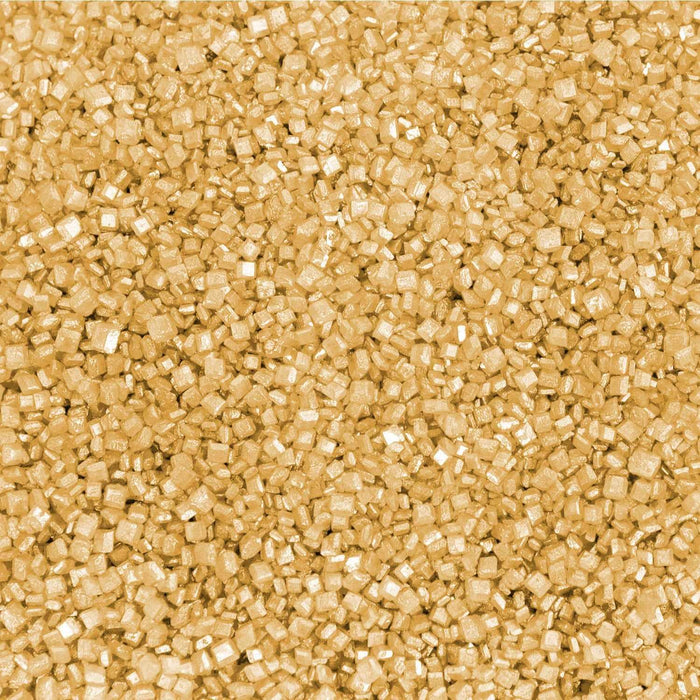 Close-up texture of shimmering yellow pearl cocktail rimming sugar with coarse, crystalline grains.