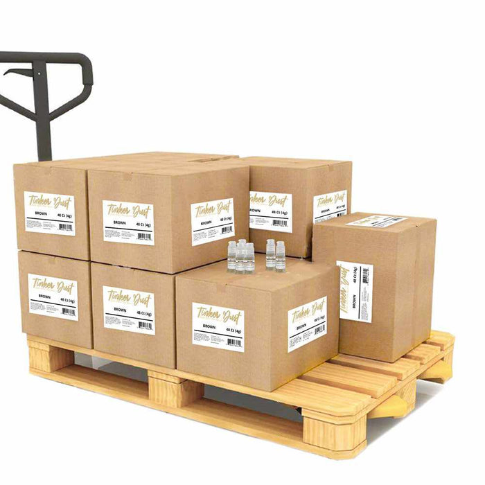 A perspective view of 8 boxes of Brown Edible Glitter on a wooden crate, with 6 individual spray pumps on one box. | bakell.com