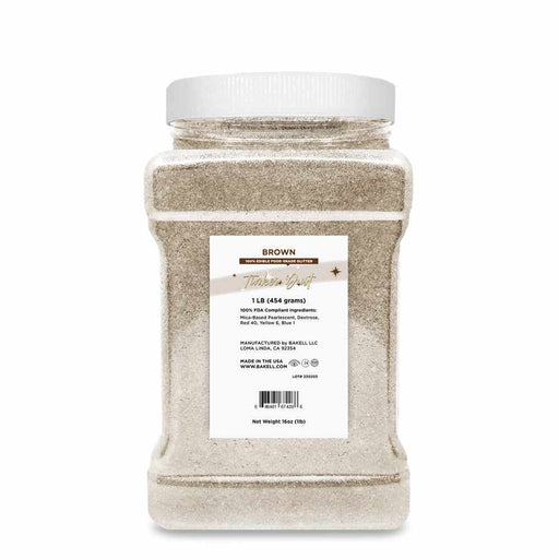 1lb bulk size of Brown Tinker Dust edible glitter in a clear plastic jar with a white lid.