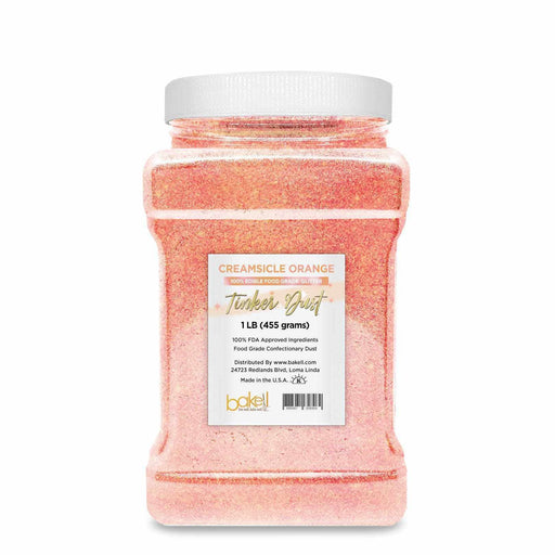 1 LB Creamsicle Orange Tinker Dust edible glitter in a clear bulk container with white lid.