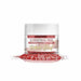 Jar of Christmas Red Tinker Dust edible glitter, 5g, with a pile of red glitter in front.