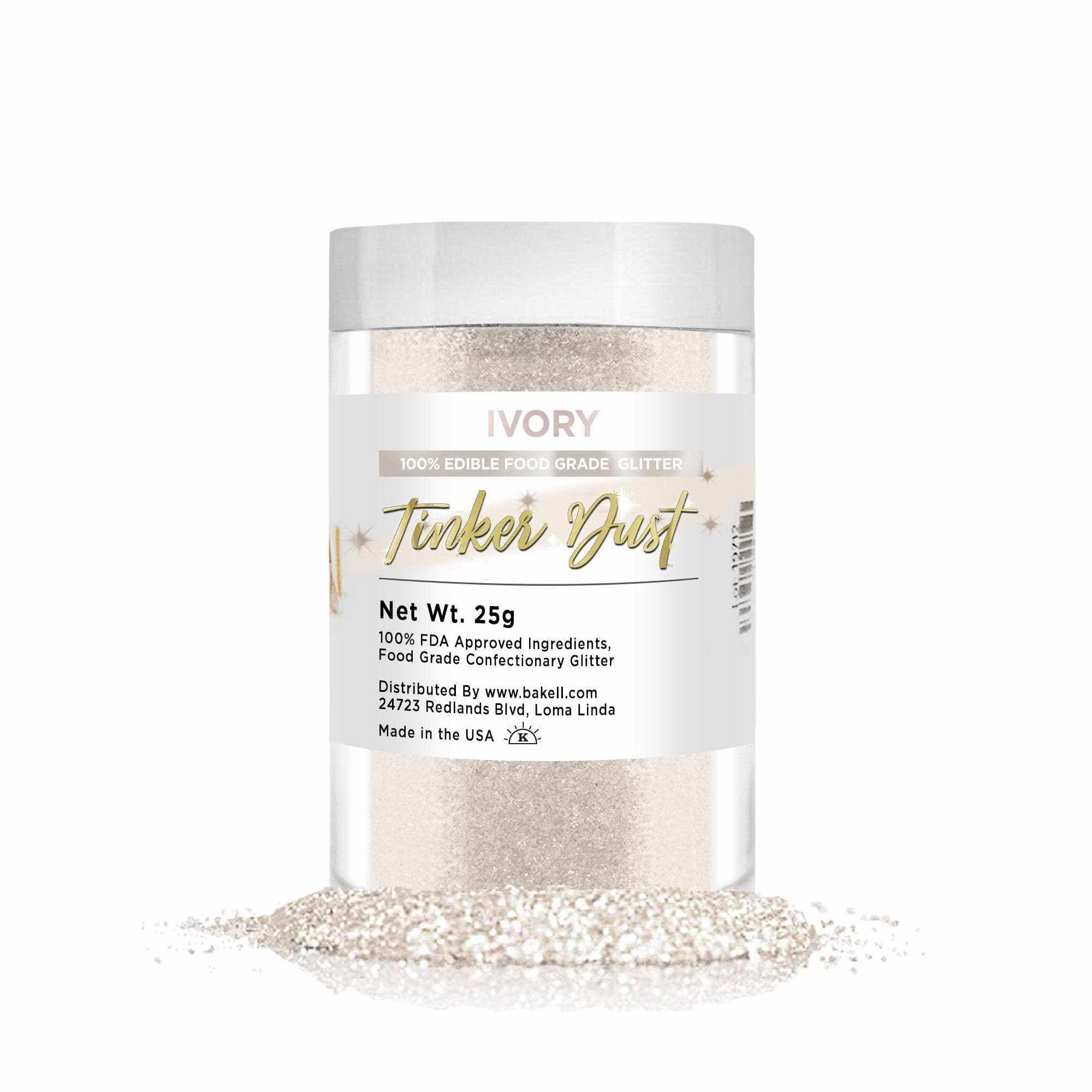 Ivory Tinker Dust edible glitter in a clear jar with a white lid, spilling onto a white surface.