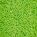 Close-up of vibrant lime green jimmies sprinkles, perfect for decorating.