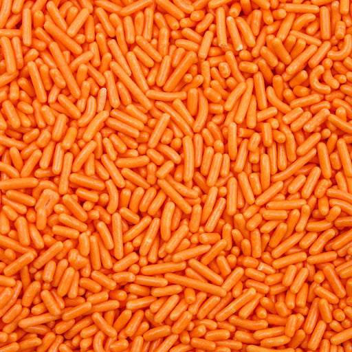 Bright orange jimmie sprinkles, a vibrant edible topping for desserts.