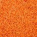 Bright orange jimmie sprinkles, a vibrant edible topping for desserts.