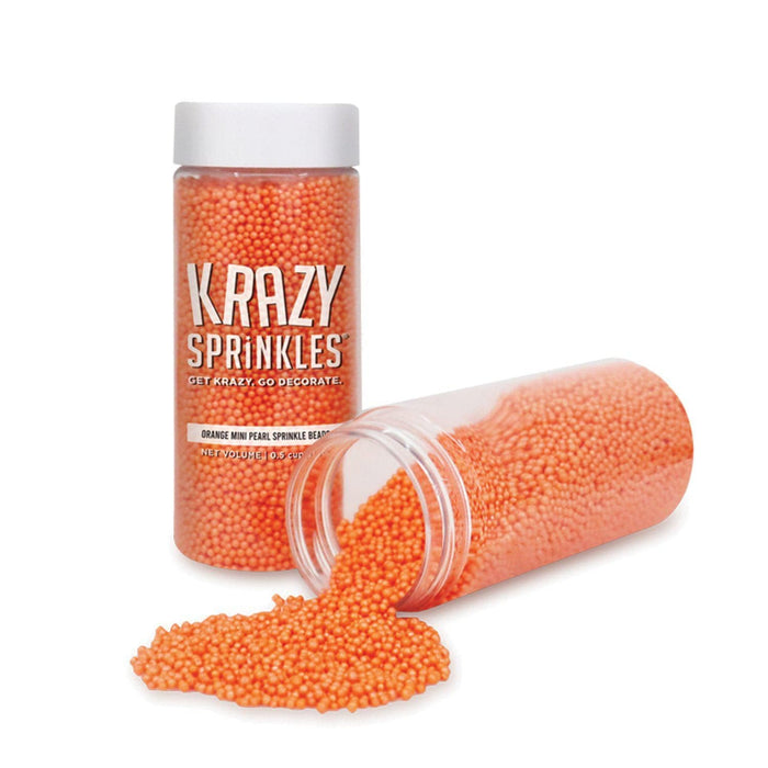 Krazy Sprinkles orange pearl mini sprinkle beads in two clear containers, one upright and one spilling.