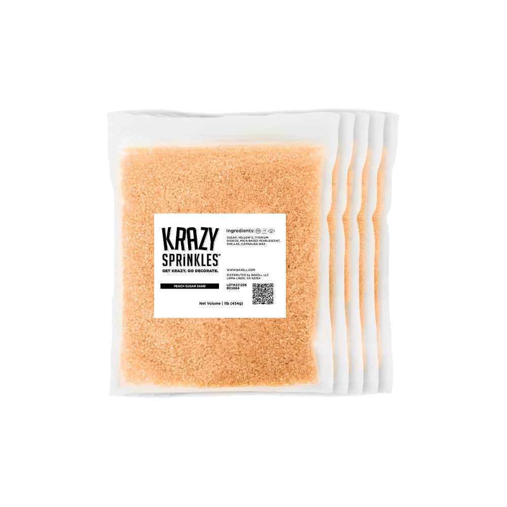 Front view of five 1 pound bags of Peach Sanding Sugar, with all of them labeled Krazy Sprinkles. | bakell.com