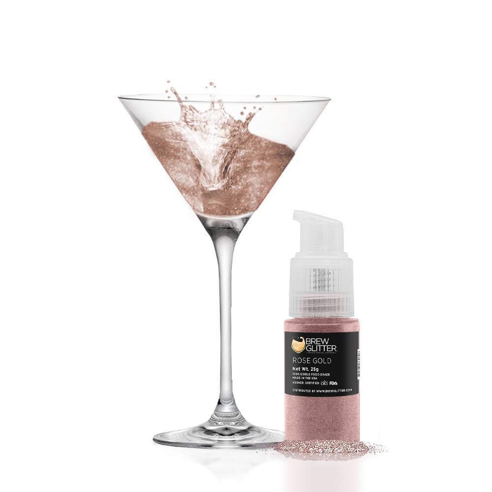 Rose gold edible glitter spray pump next to a martini glass with shimmering rose gold liquid.