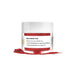 Red Petal Dust in a clear jar with white lid, next to a small pile of red powder.
