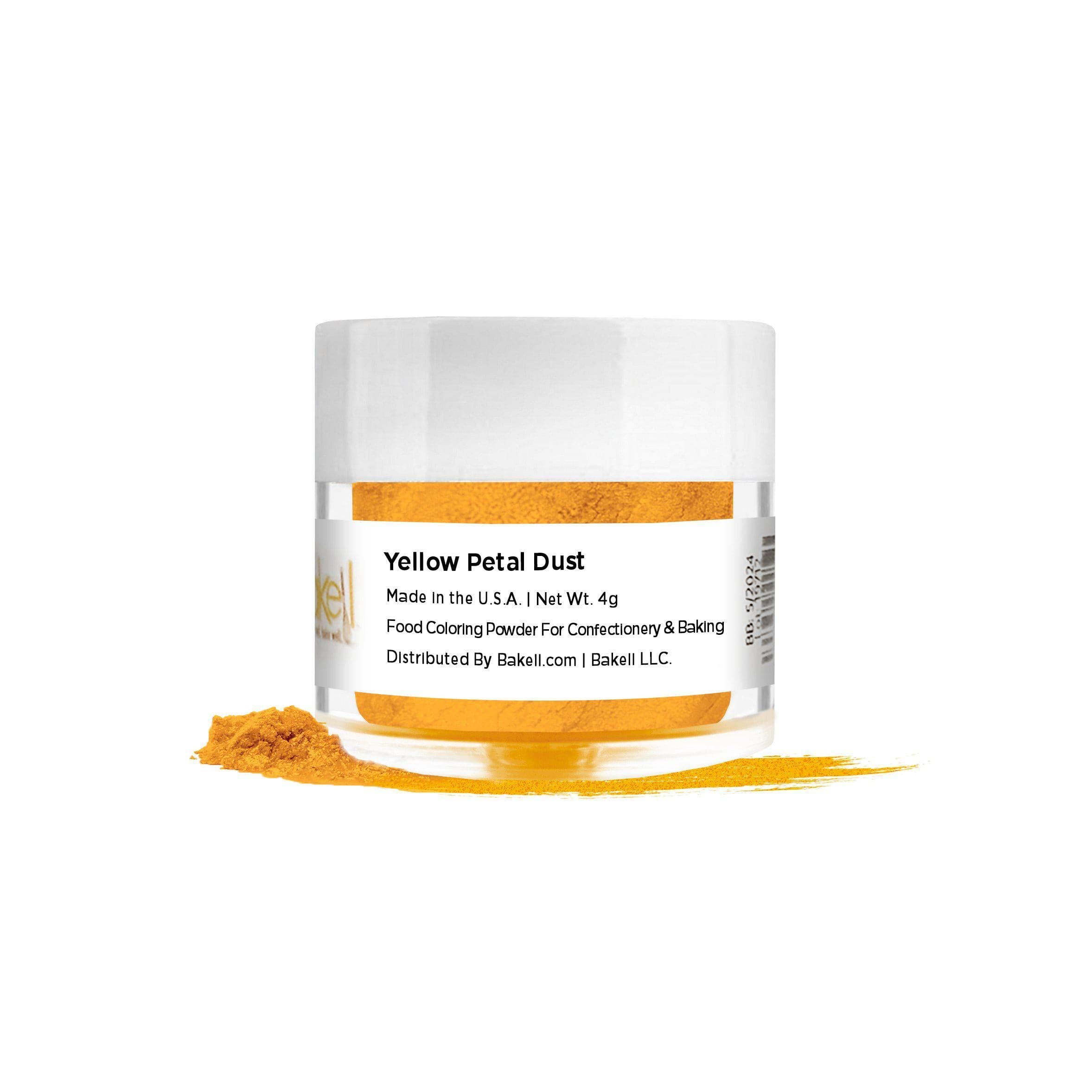 Yellow Petal Dust food coloring powder in a clear jar with a white lid, spilled on a white surface.