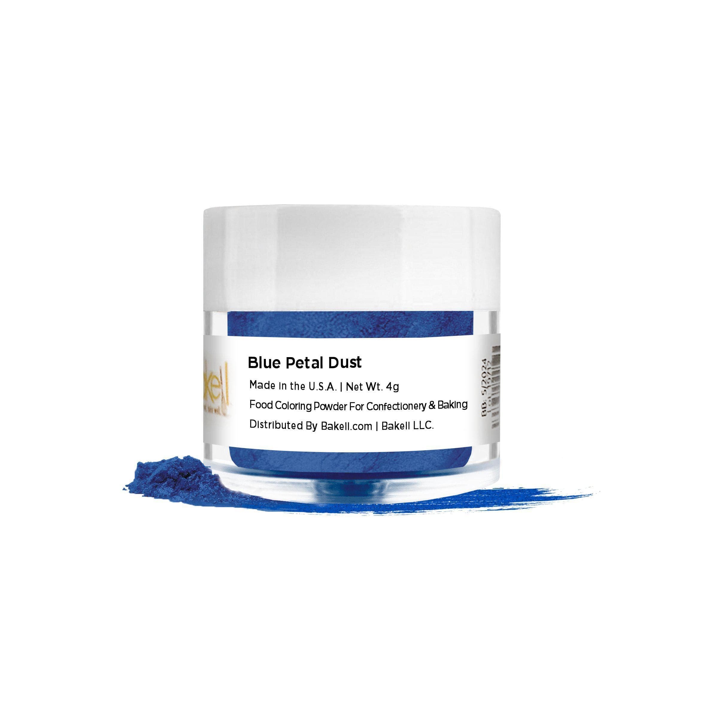Blue Petal Dust in a clear jar with a white lid, spilling vibrant blue powder onto a white surface.