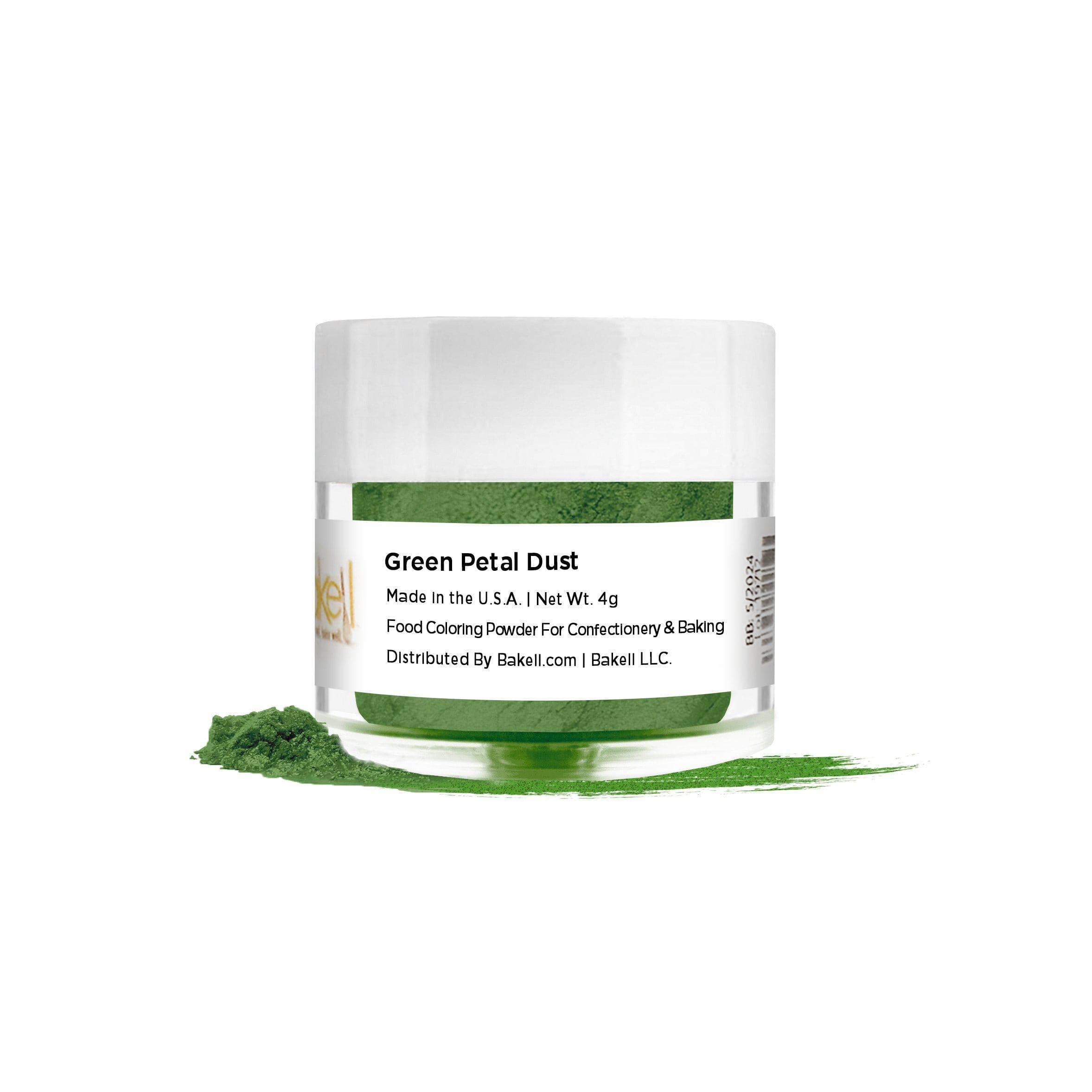 Green Petal Dust in a clear jar with a white lid, with some powder spilled on a white surface.