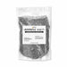 One-pound bag of shimmering black cocktail rimming salt with a white label featuring ingredients and branding.