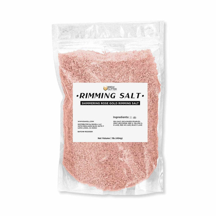 One pound bag of shimmering rose gold cocktail rimming salt with a white product label on a clear pouch.