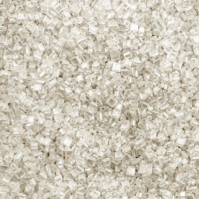 Close-up texture of sparkling white pearl cocktail rimming sugar with coarse, crystalline grains for drink garnishing.