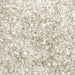 Close-up texture of sparkling white pearl cocktail rimming sugar with coarse, crystalline grains for drink garnishing.